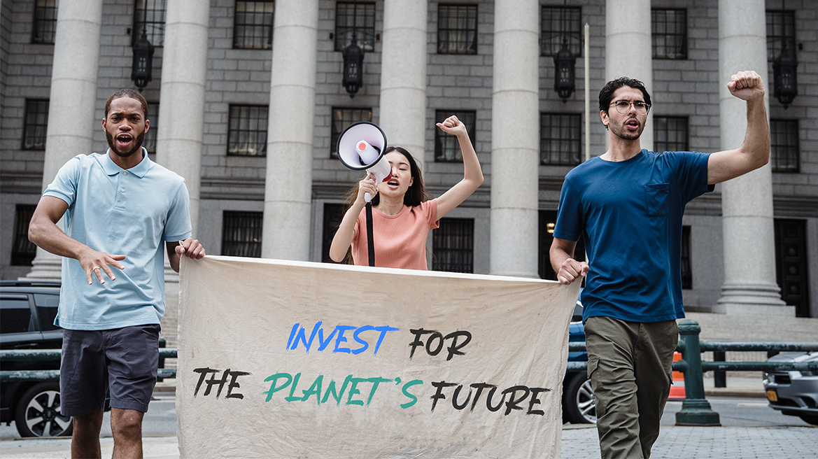 three people protesting for planet safety